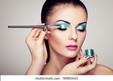 Makeup Artist Applies Eye Shadow. Beautiful Woman Face. Perfect Makeup. Makeup Detail. Beauty Girl With Perfect Skin. Nails And Manicure