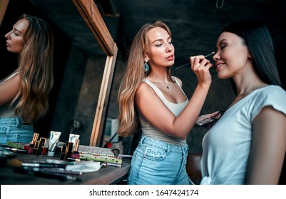 Makeup Artist In Beauty Studio Working With Beautiful Asian Makeup Model