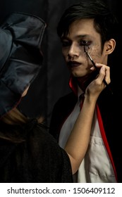 Makeup Artist do Asain teenager makeup for Halloween costume as Vampire  prepare for Carnival of Halloween Party 