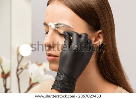 The make-up artist does Long-lasting styling of the eyebrows and will color the eyebrows. Eyebrow lamination. Professional make-up and face care.