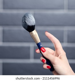 Makeup Artist Shakes Off The Powder With Makeup Brush Dust Hanging In The Air