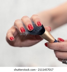 Makeup Artist Shakes Off The Powder With Makeup Brush Dust Hanging In The Air