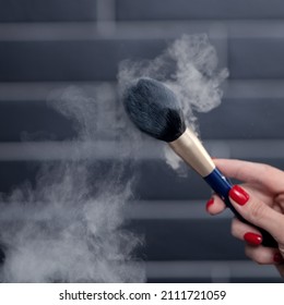 Makeup Artist Shakes Off The Powder With Makeup Brush Dust Hanging In The Air