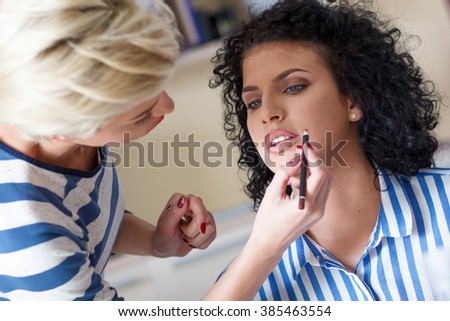 Make-up artist work in her studio.