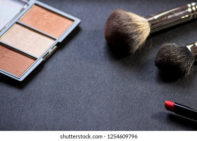 Makeup Brush . Face Powder Bronzer And Cosmetic Blush Brush. Red Lipstick.