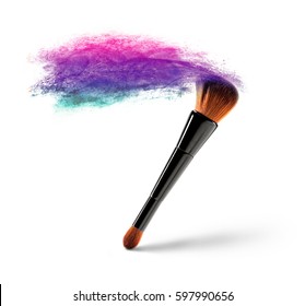 Makeup brush with multicolored powder splash on a white background.