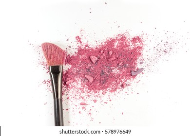 Makeup brush on white background, with vibrant traces of powder and blush. A horizontal template for a makeup artist's business card or flyer design, with plenty of copy space