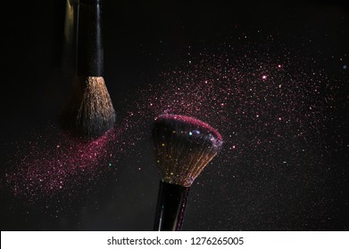 Makeup brush with pink glitter dust