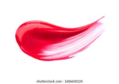 Makeup Brush stroke. Red Lip gloss face make-up sample. Pink color cosmetic liquid lipgloss smudge smear. Make up smear isolated on a white background. Macro of Lipstick close-up