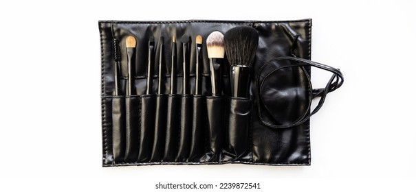 Makeup brushes in a black case on a white background.Cosmetic brush. Kit.