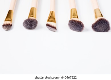 Makeup brushes set in row on white isolated background. Cosmetics and beauty. - Shutterstock ID 640467322