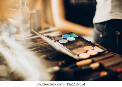 make-up concept. makeup set of brushes, powder,eyeshadows on table. artist making make up for bride in the morning. beauty and fashion image