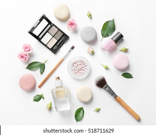 Makeup cosmetic and macaroons   beautiful flowers white background