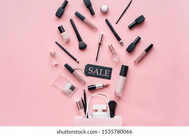 Makeup Cosmetic Perfume Women Products Accessories Pouring From Shopping Bag On Pink Flat Lay Background, Beauty Products Cheap Discount Retail Offer Online Purchase, Top View Above Copy Space