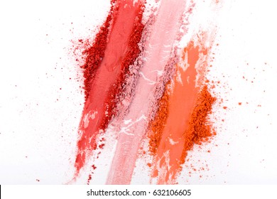 Makeup cosmetics. Blush crushed palette strokes, colorful powder on white background, art of make-up