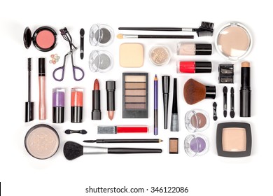 makeup cosmetics and brushes on white background 