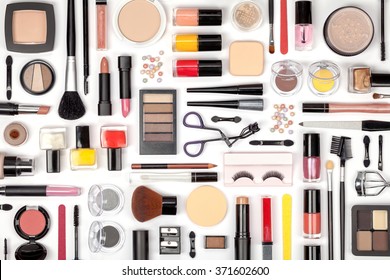 makeup cosmetics  brushes   other essentials white background top view  beauty flat lay concept