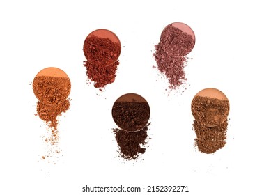Makeup cosmetics. Eyeshadow crushed palette, colorful eye shadow powder isolated on a white background.