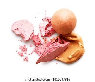 Makeup foundation smear and broken blush isolated on white background