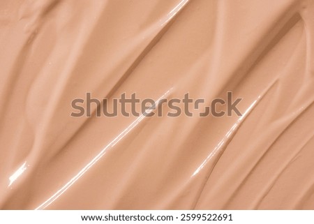 Makeup foundation texture swatch. BB cream, concealer, paint smear background. 