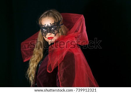 make-up girl witch on halloween costume in black mask