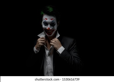 Makeup for Halloween: Image of a man in a joker makeup - Shutterstock ID 1530616739