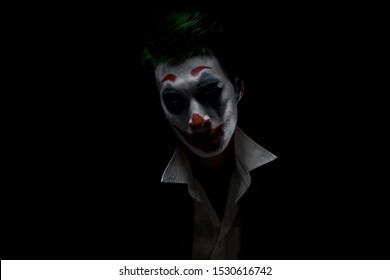 Makeup for Halloween: Image of a man in a joker makeup - Shutterstock ID 1530616742
