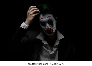 Makeup For Halloween: Image Of A Man In A Joker Makeup