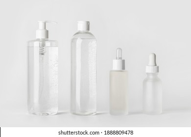 Makeup Kit. Micellar Water, Toner, Face Serum And Hyaluronic Acid. On A Light Gray Background..
