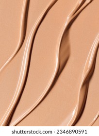 Makeup Liquid foundation composition background. BB CC Cream Concealer texture. Cosmetic product brush swatch