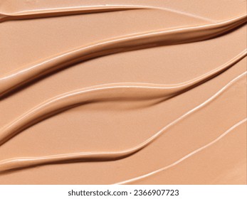 Makeup Liquid foundation composition background. BB CC Cream Concealer texture. Cosmetic product brush swatch