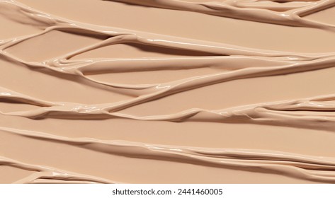 Makeup Liquid foundation composition background. BB CC Cream Concealer texture. Cosmetic product brush swatch