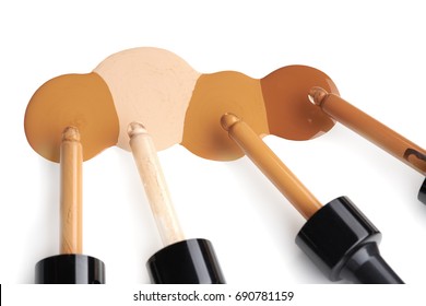 Makeup Liquid Foundation On White Background. Texture Of Liquid Foundation For Make-up Of Various Shades Of Skin On A White Background