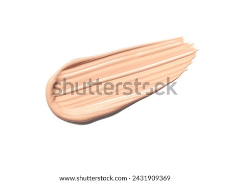 Makeup Liquid foundation smear composition isolated on white background. BB CC Cream Concealer texture. Cosmetic product brush swatch