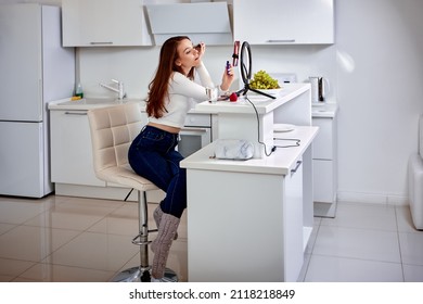 Makeup Live Streaming By Woman Using Handy And Ring Light.