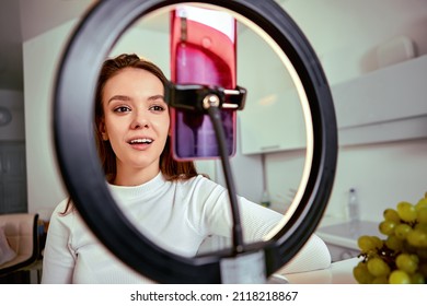 Makeup Live Streaming By Woman Using Smartphone And Ring Light.