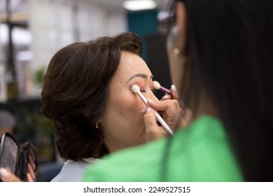 Makeup process, make-up artist paints model in salon - Shutterstock ID 2249527515