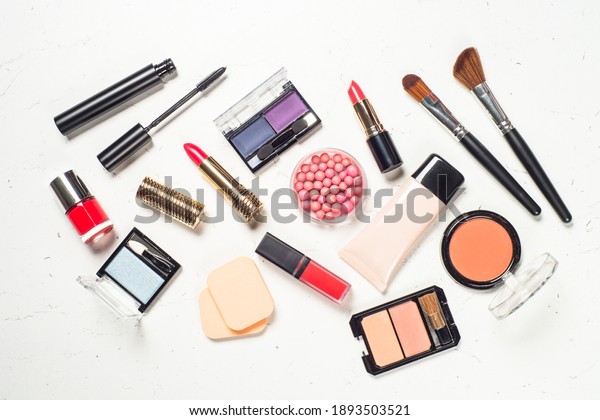 Makeup\
professional cosmetics, decorative cosmetic on white marble\
background. Flat lay image with copy\
space.