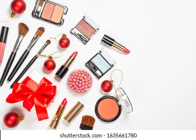 Makeup professional cosmetics on white background with christmas decor. Top view with copy space. - Shutterstock ID 1635661780