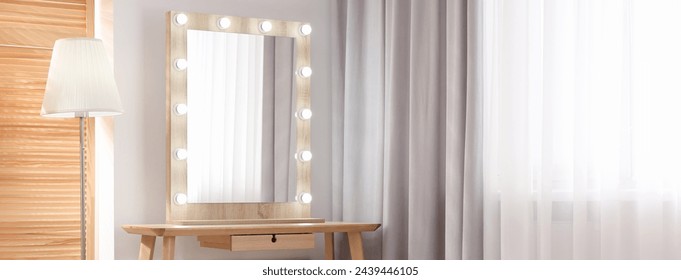 Makeup room. Dressing table with mirror and lamp indoors, space for text. Banner design