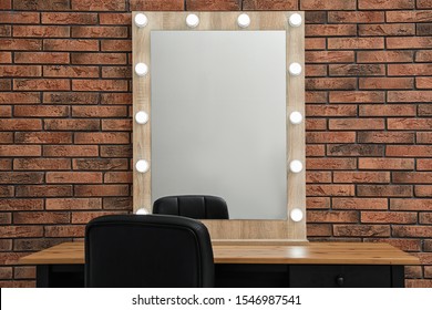 Makeup Room Interior With Wooden Table And Large Mirror