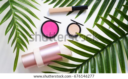 Makeup summer sale banner with palm leaf, consilier, blush, eyeshadow and body milk. Flat lay. Top view. Imagine de stoc © 
