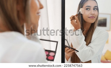 Makeup, wedding and bride with a woman using cosmetics on her face before a marriage ceremony or celebration event. Beauty, tradition and smile with a happy female putting blusher on her skin ストックフォト © 