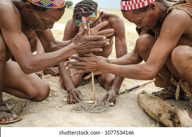 Makgadikgadi Salt Pans, Botswana - April 1st 2015: Traditional Basarwa fire making using friction heat