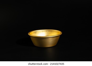 Makgeolli rice wine is a Korean fermented alcoholic beverage traditional drinks. 
Korean alcoholic drink (Makgeolli) in a traditional Korean gold liquor bowl with snack on Black background. 