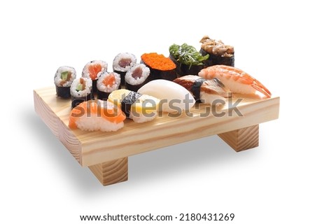 Maki Sushi Rolls on bamboo board isolated on White background with clipping path