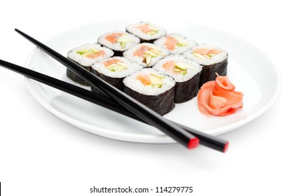 Maki Sushi Rolls On The Plate With Chopsticks, Isolated On White