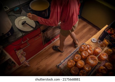 Making of apricot compote on wooden table interior middle of summer with male - Shutterstock ID 2175668881