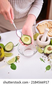 Making Avocado Toast - Woman Peeling Ripe Halved Avocado