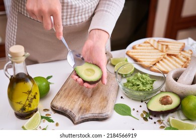 Making Avocado Toast - Woman Peeling Ripe Halved Avocado